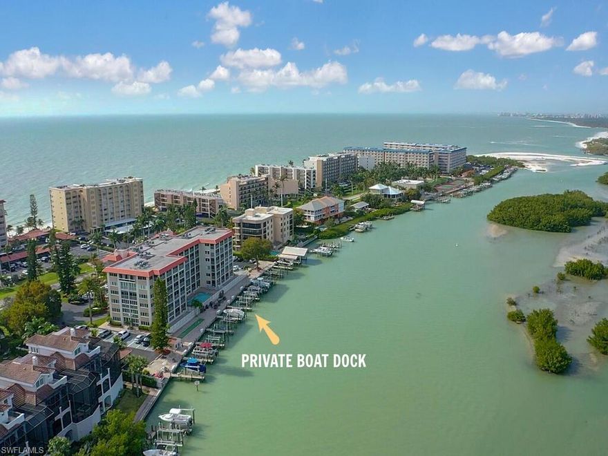 Your beach and boating retreat awaits! Located on the 5th floor this unit has one of the most spectacular views in the building, the inside corner allows for expansive views of the bay, mangroves and the gulf beyond. Enjoy the views from your large screened lanai as the sea breeze blows through the sliders of the master bedroom and living room. Enjoy the direct access to the gulf from your boat dock included with this unit or relax on the beach located directly across and easily accessed via the deeded beach access. The unit is tastefully remodeled throughout with wood look tile, granite counter tops, 2018 AC and electric storm shutters. Two bedroom, two bathrooms and a deeded under cover parking space. Sold furnished this condo is ready to move right in.