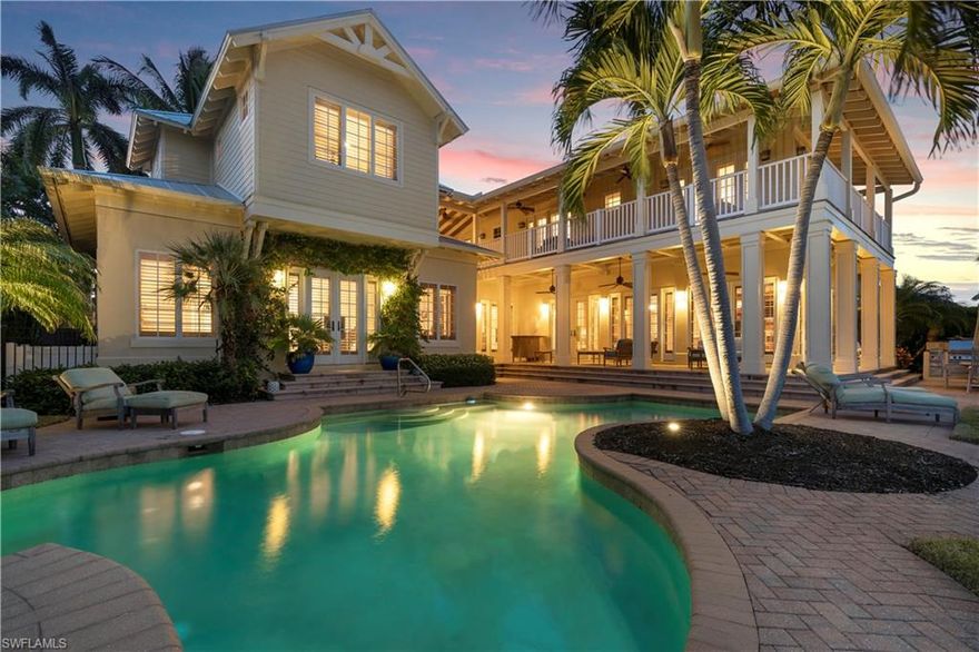 Enjoy beautiful water views set over a wide canal and a prestigious Aqualane Shores location within walking distance to the beach and Third Street South, plus direct access to the Gulf of Mexico! Located on a quiet cul-de-sac, this coastal residence exudes Old Florida charm. Over 4,800 square feet of relaxing living space offers a desirable first floor master suite, plus three ensuite bedrooms upstairs, and two private den areas connected to the bedrooms via an outdoor breezeway. Designed for sophisticated entertaining, the floorplan flows easily from indoors to out, where an inviting outdoor oasis awaits with a private pool, spa and outdoor kitchen. Set sail from your very own custom built, concrete floating dock with boat lift or the kayak launch dock. Live the ultimate boater’s dream and make this home your own.