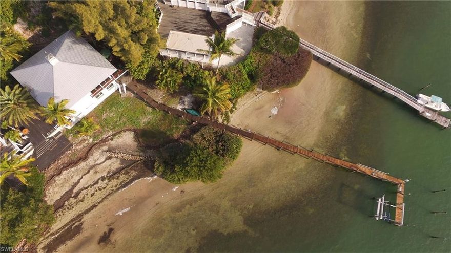 "Tranquility Cottage" is a two bedroom, two and a half bath villa located on the eastern waterfront of Useppa Island. This is the only villa on the island which has it's own private, deep water dock and there are many more qualities that set it apart from the rest. 
The interior has been tastefully renovated and updated to create a clean and open feel. The bedrooms and their en-suite baths are on the ground floor while the living area, kitchen and half bath are upstairs. This "up-side-down" floorplan is one which puts focus on amazing views in the areas of your home most time and entertaining is spent. Despite being on the ground floor, the master bedroom's view down the private dock and over the waterfront is amazing. 
An upper deck built featuring Ipe decking extends outside the upstairs living area and offers spectacular outdoor space which overlooks the dock and waterfront. The dock was re-framed and decked within the last five years and extends to deep water with an exterior wet slip which could accommodate a large yacht. Additionally, there is an interior slip with a nearly new 12k lift for a center console, making a very accommodating situation for the avid boater.