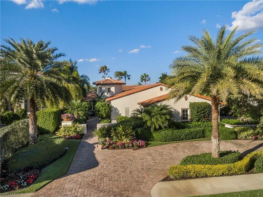 Simply Beautiful – Inside and Out! With Gorgeous Golf Course & Lake views, this former London Bay Model Home is being offered fully furnished. Designed with a transitional flair, the Great Room floor plan surrounds a private courtyard with fountain and cast stone fireplace. Offering 4,273 sq. ft. of AC living space, rooms flow perfectly from indoors to outdoors providing a true Florida Lifestyle Experience. There is a Large Master BR Suite, 2 guest BR suites + study with a full walk-in closet which can become a 4th BR  space, if desired. In addition to 3 full BA's there are two ½ BA's.  Features include wood flooring throughout main living areas, extensive mill work, chef’s kitchen w/Wolf Gas Range & Sub Zero Refrigerator + large center island w/ breakfast bar, spacious dining area, built-in custom designed entertainment center, complete sound system and a custom built, climate controlled wine cellar. Covered lanai has summer kitchen, living & dining areas. The free form pool + spa overlook the green of the 15th hole of the Lakes Course.  Other features - too numerous to list (see attached feature sheet). Sellers are offering a $30,000 credit toward the mandatory club membership.
