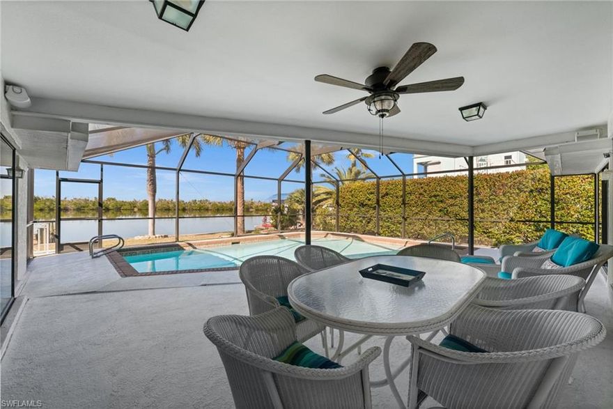 Bayfront Pool Home with Direct Gulf Access in St. James City! Perfectly positioned on the bay with sweeping water views from nearly every room, this 3-bedroom, 2-bath pool home captures the essence of waterfront living in St. James City. Designed in an inviting layout, the home wraps around the pool and lanai, making the bayfront views a striking focal point throughout. From the moment you enter, you’re greeted by a dramatic sightline straight to the water—framed by floor-to-ceiling sliders and expansive windows overlooking the pool and bay. The thoughtfully designed floor plan offers separate living areas, providing flexibility for full-time living, seasonal use, or short-term rental guests. To the right, a family room and formal dining area lead to the private primary suite. This tranquil retreat features direct lanai access through sliders, a spacious walk-in closet, and an updated bath with a walk-in shower, granite countertops, and a custom vanity. On the opposite side of the home, the kitchen anchors the guest wing and main living space. It features new lower cabinets, quartz countertops, and the option to add additional cabinetry to create a bar or coffee station—ideal for entertaining. The adjacent living room is accented by exposed ceiling beams and pocket sliders that open wide to showcase the bayfront setting. Two guest bedrooms and a full guest bath complete this wing, with the guest bath doubling as a pool bath. One guest bedroom enjoys its own private bayfront patio—perfect for morning coffee with a view. Outside, the pool and lanai create a resort-style atmosphere, perfect for relaxing or hosting guests. The waterfront dock and boat lift provide the opportunity to customize or redesign to suit your boating lifestyle, whether that’s accommodating a specific vessel, adding seating, or creating an enhanced entertaining space. With quick, deep, direct Gulf access, you’re minutes from Pine Island Sound’s renowned fishing and boating, as well as the world-famous beaches of Sanibel, Cayo Costa, and Boca Grande. Located in a golf cart-friendly community, this home is well-suited as a primary residence, second home, or income-producing investment, offering strong appeal for short-term rentals thanks to its waterfront setting, pool, multiple living spaces, and proximity to top island destinations.