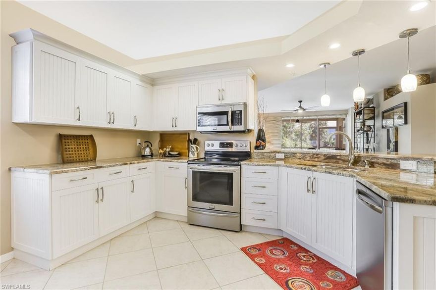 This bright end-unit coach home lets natural light spill into the interior and extends a warm welcome. A blend of classic character and cozy touches with neutral finishes creates a look that is inviting and timeless. Features tile floors and beautiful granite counters in kitchen and baths. The spacious eat-in kitchen offers white shaker cabinetry. A large bar opens to an inviting dining room and great room. Sip your morning coffee on the screened lanai overlooking the lake with a fountain view and aroma of Gardenia trees. Split bedrooms offer the privacy you and your guests deserve. The third bedroom is set up as a den with built-in bookshelves. This unit comes with a detached one-car garage. RENOVATED in 2014 with a timeless design that looks like new. NEW TILE ROOF. Calusa Bay offers an active lifestyle - Clubhouse, fitness facility, playground for children, nature trail, basketball court, two community pools (lap, resort, and spa), library, two Har-Tru Tennis Courts, plus on-site Manager. Located Close To Waterside Shops, Mercato, Restaurants, Entertainment, and famous Naples Beaches. Great Home and Great Location in prime North Naples and A+ rated schools.