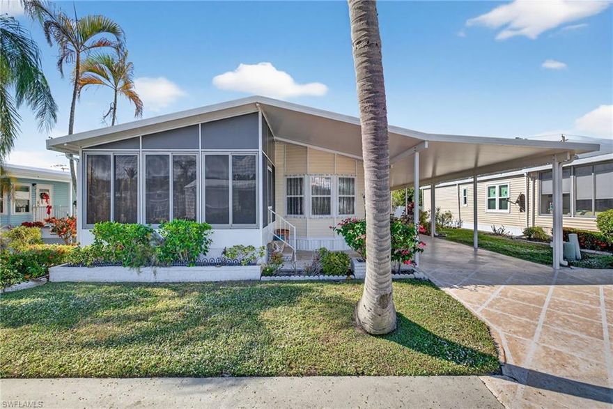 Welcome to easy Florida living in this furnished, move-in-ready two-bedroom, two-bath home located within a desirable 55+ community. Recent improvements include windows, shutters, along with updated flooring throughout the living, dining, and kitchen areas, enhancing both comfort and style.

Bright and open, the interior is filled with natural light, creating a warm and welcoming atmosphere throughout the day. Enjoy outdoor living with multiple spaces designed for relaxation and entertaining. The backyard patio is ideal for afternoon enjoyment, while the extended side carport/lanai area offers a great setting for evening cookouts and gatherings with friends. An additional parking pad provides convenient space for a golf cart.

The front screened lanai features a window A/C unit, making it a versatile space that is perfect for hosting visiting guests or creating a cozy retreat.

Residents enjoy a well-maintained community with amenities and activities, conveniently located close to shopping, dining, vibrant Fifth Avenue, and the beautiful beaches of Naples. This property offers excellent flexibility, making it a great option for investment, full-time residence, or seasonal ownership.