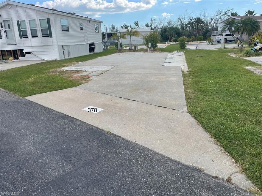 ** New 50 AMP electric service post installed 5/3/24*** Welcome to Palmetto Palms RV Resort and Condominium Association where you own the land! Located “B” Street, this lot is between the 2 community pools, close to the Volleyball, Horseshoe pits, and the walking path/bridge over the lake, and a short walk to club house, tennis, pickleball, and shuffle boards. This lot will accommodate a manufactured home, camper, 5th wheel, RV, or tiny home.  Just 1 mile from Bunche Beach and 4 miles from Times Square Fort Myers Beach! The park did sustain damage from Hurricane Ian, and the amenities are currently being restored. Sewer, water, elec, and internet are all available. Located in the non-pet section of a 55+ beach community.