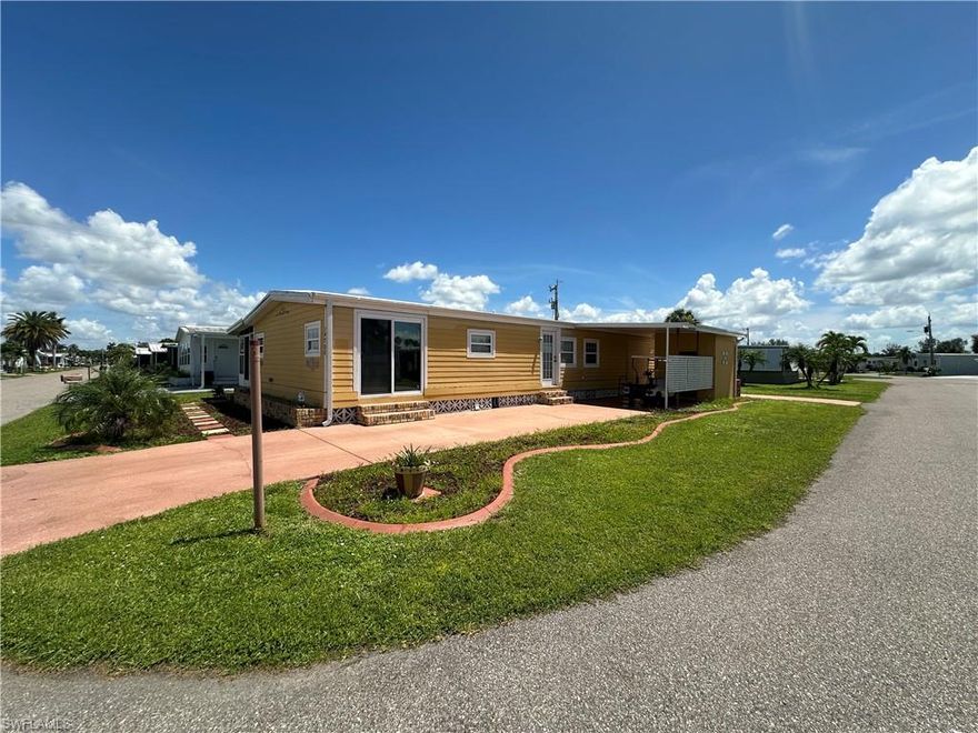 Excellent investment opportunity in this corner-lot home located in a premier 55+ Gulf-access, riverfront co-op community - SHARE INCLUDED! Property features 2 bedrooms, FLEX Room/Den and 2 bathrooms, Large owners suite with walk in closet. While the property sustained damage from Hurricane Ian, it has been remediated and cleared out. Other key upgrades include updated PVC plumbing, Miami Dade-rated windows & doors, Hardie Board exterior over Tyvek insulation & 5/8 inch sheathing plywood, a screened lanai, and 2 oversized driveways with parking for 4+ cars and enclosed utility shed. This resident-owned community is designed for the active Florida lifestyle. Enjoy two pools, hot tub, fitness center, tennis, pickleball, bocce, shuffleboard, and basketball courts. Spend evenings watching sunsets at Palm Point Park’s 9-acre waterfront preserve, or take advantage of the 81-slip marina with boat & kayak launch for direct Gulf access through Lighthouse Marina. Whether you’re an investor ready to renovate or a buyer seeking an affordable entry into Southwest Florida waterfront living, this home offers both potential and lifestyle. SOLD AS IS, CASH ONLY. No pets allowed.