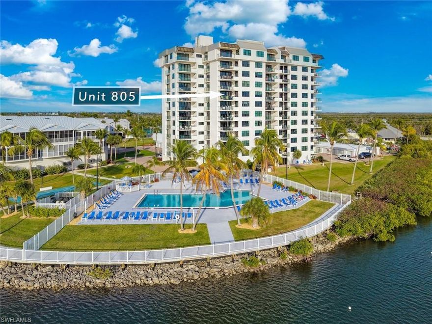 If you enjoy watching dolphins, manatees, and pelicans with spectacular views from every room, this is the place! This light and bright, turnkey-furnished, 2-bedroom, 2-bath corner unit on the 8th floor features a SW exposure, providing incredible year-round sunsets and endless bay and gulf views from Sanibel Island to Bonita Springs and beyond! Updates include hurricane-rated sliding glass doors and windows, HVAC system, paint and trim, LV flooring throughout, a stackable washer/dryer, window treatments, ceiling fans, and light fixtures. The galley-style kitchen updates include soft-close cabinets and drawers, quartz countertops, new appliances, tile backsplash, and a tray ceiling. The primary bedroom features bay views, lanai access, remote-controlled window shades, and an ensuite bathroom. Both bathrooms feature updated vanities, quartz countertops, new tile, fixtures, showers, and lighted mirrors. Boardwalk Caper is an active gated, direct gulf access community with reasonable HOA fees and over 200 boat slips with a 1/2 mile long boardwalk along a wide, deep water canal, with tennis, pickleball, and shuffleboard courts, and 4 pools. The building has new elevators, new lanai rail systems, a heated, resort-style pool on the bay, an exercise room, a community/entertainment room, a Tiki Bar and grilling area, a kayak/paddleboard launch, storage lockers, and more! The community grounds, docks, and amenities were recently updated, with plenty of boat slips available for sale or lease, plus the $1,800 quarterly condo fee is much lower than any comparable properties! The soft, white sand beach, with its vibrant restaurants and entertainment district, is just a short distance away, and the trolley stops right in front of the complex during the busy season. There's a popular seafood restaurant and marina right next door, with boat/kayak/sup rentals, a boat club, dolphin/shelling/sunset tours, fishing guides, and offshore charters. This is a great opportunity to relax in comfort, enjoy spectacular views, and experience everything the SWFL lifestyle has to offer!