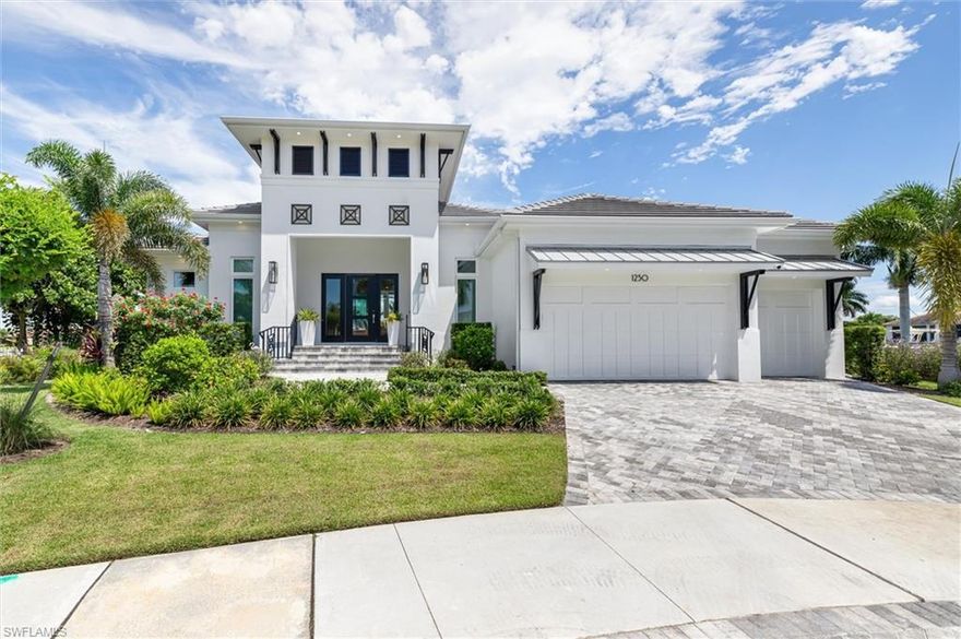 Discover your dream waterfront oasis in this stunning, newly built home on a spacious tip lot with 166 feet of frontage. Surrounded by tropical landscaping, the property boasts a brand-new seawall that spans the entire waterfront. The back of the home features 10-foot impact sliders, offering breathtaking water views and filling the space with natural light. Beautiful hardwood floors throughout the living areas and bedrooms add warmth and elegance.
The open-concept kitchen and dining area is a culinary delight, showcasing luxurious quartz countertops and backsplash that perfectly complement the large island with seating for four. Outfitted with top-of-the-line Subzero-Wolf appliances, including a gas range, dual Asko dishwashers, and an oversized refrigerator, this kitchen caters to the most discerning chefs. Additional highlights include instant hot water, a touchless faucet, a pot filler, and a two-zone wine refrigerator in the pantry.
The primary suite is magnificant with private sliders to the lanai, where you can relax and enjoy stunning water views. The spa-inspired en-suite bath features dual vanities, a luxurious walk-in shower with dual showerheads, a soaking tub, and an outdoor shower. Two additional guest bedrooms, both with en-suite bathrooms and large walk-in closets, provide ample space for family and guests. A versatile den/office space with lanai access can easily be used as a fourth bedroom if desired.
Outdoor living reaches new heights on the expansive lanai, where you can watch manatees and dolphins play in the canal. The covered area with picturesque water views and a motorized privacy screen is perfect for ultimate relaxation. The outdoor oasis continues with a pool, spa, outdoor grill, and seating area overlooking the serene waters. For boating enthusiasts, a new 998-SF Azek dock includes a 7,000-lb lift for jet skis, a 14,000-lb boat lift, plumbing with two faucets and a fish cleaning station.
This home is packed with upgrades, including an app-controlled pool and spa system, LED perimeter lighting, and a Sonos speaker system. A three-car garage with epoxy floors offers ample storage, while a 500-lb underground propane tank fuels the pool heater, stovetop, grill, dryer and hot water. With too many features to list, this property truly embodies the essence of luxury waterfront living—you must see it to believe it!