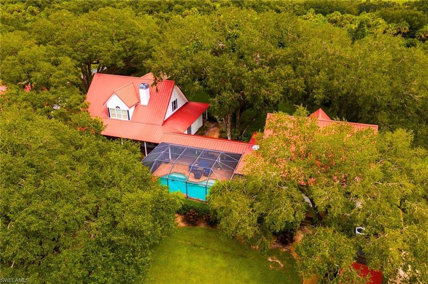 Luxury meets country charm within this Exceptional 3.02-Acre gated estate in LaBelle, Florida!
Welcome to this rare multi-residence property offering over 5000 Sq ft of living space across the main home, guest house, and garage apartment. The two-story main home features cathedral ceilings, a beautiful eat in kitchen with stainless steel appliances and a stunning floor to ceiling fireplace. Eating dinner in the formal dining room with the beautiful views from the surrounding windows will make family dinners unforgettable. Step into a breathtaking master suite designed for both comfort and style. This spacious retreat features a private bathroom with a separate soaking tub and shower, custom-designed closet with ample storage, built-ins, and useful finishes to keep your wardrobe organized and accessible. The suite also boasts a dual-sided fireplace, thoughtfully engineered to open to both the bedroom and the living room, creating a warm, inviting atmosphere and a seamless flow between spaces. The 2 story Guest house features a full kitchen, large family room, 2 bedrooms and downstairs bath. The extra apartment provides 1 bedroom, 1 bath, and a full kitchen above a 3-car garage with workshop/gym. Enjoy resort-style outdoor living with a saltwater pool, triple waterfall, and screened lanai connecting to the main house with a paver walk way. Nestled on the property is a charming shed-style building, perfect as a home office, creative studio, or “she shed.” Its cozy yet functional layout offers a private retreat, ideal for focused work, hobbies, or quiet relaxation. With its quaint design and versatile space, it adds both character and utility to the property, providing a peaceful escape right in your backyard. The property is fully fenced with dual electric gates, surrounded by beautiful mature oak trees, and includes a 3 bay pole barn with separate areas for different animals near by. The large fenced in side yard is suitable for horses. Perfect for multi-generational living, entertaining, or income potential, this estate combines privacy, luxury, and versatility in one of LaBelle’s most desirable Communities "The Ranchettes"!