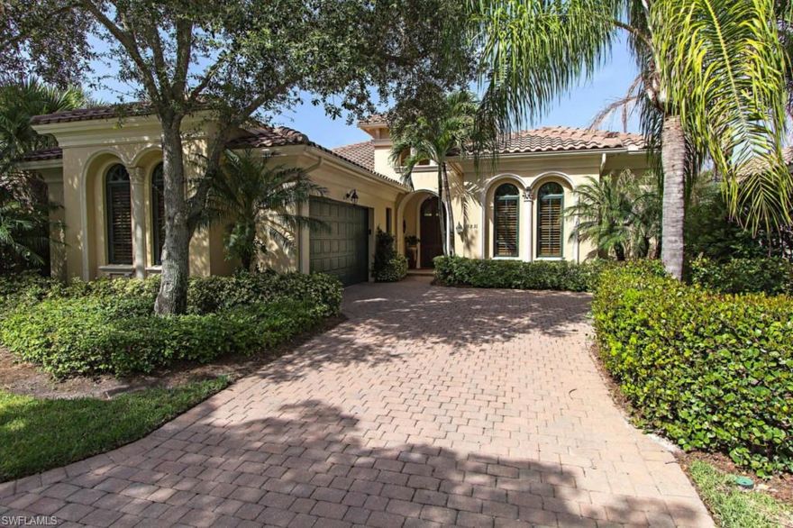 This is the home you have been waiting for in prestigious Sweet Bay. Beautifully appointed 3 bedroom or 2 bedroom + den classic Mediterranean styled home with custom designed wood entry door and precast architectural trim in front and on lanai. Open, great room floor plan. Large lanai with summer kitchen, pool and spa has a dramatic view of the lake, #17 fairway and green and preserve. Sun screen at lanai sliders in great room. Formal dining room. All interior doors solid core raised panel. Granite kitchen countertops and marble vanity tops in baths. Teak hardwood floor in den with custom built ins. Tile on diagonal in living areas. Gourmet kitchen with ceiling mounted pot rack, S/S appliances most new 2013, natural gas cooktop, custom cabinets, and center island. One of the largest lanais in Sweet Bay extended in length and width with new paver stones. Large outdoor summer kitchen with new natural gas grill topped with a pergola. Electric fabric screen hurricane shutters at front door and covered area of lanai. HVAC system new in 2008. Exterior painted in 2014. 2 car garage. Quiet location, easy quick access to The Commons Club, Golf Academy and Country Club.