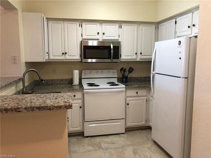 End unit 3 bedrooms, 2 full baths on second floor of building in quiet section of The Tides, away from US 41 noise. An attached one vehicle garage (#16) is included in purchase price. Furnishings are negotiable. Kitchen has granite counter tops and newer refrigerator and microwave. Undermount stainless steel sink. Abundant white cabinets. HVAC was replaced April 2019. All new blinds and windows in unit, energy efficient and storm impact resistant. Two baths remodeled with granite counter tops, soaking tub and shower. Entry foyer with oversized tile floor and closet. Living area is carpeted. Screened lanai/patio off the great room. Unit close to sports area with tennis and volleyball.  The Tides is 5 minutes from Coconut Point mall with entertainment, retail shopping and dozens of restaurant choices. Within The Tides you can enjoy an active lifestyle with the resort style pool and spa, exercise room, pickleball and basketball. Directly across US 41 is the new Lee Healthcare outpatient facility with emergency and diagnostic care available 24/7. Gulf beaches and condo to airport are only 20 minutes away. This is a must see property and available for a quick closing.