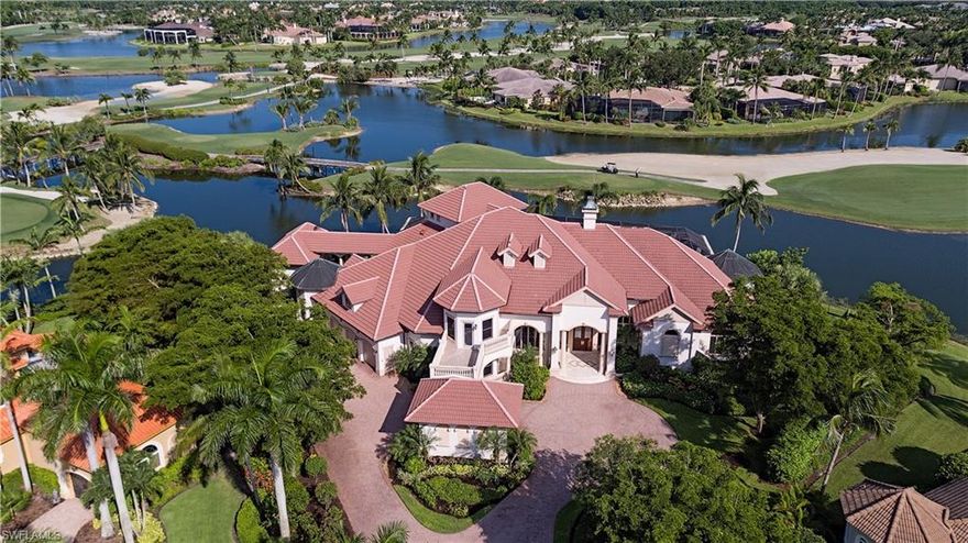 One of the BEST premium PANORAMIC  lake/golf view homesites in ALL of Grey Oaks - located on a quiet cul-de-sac in prestigious Isle Toscano. This partially Renovated home boasts over 7,000 square foot with six-bedrooms plus den and includes approximately 250 feet of lake frontage nestled in the exclusive Isle Toscano neighborhood. Nearly every room overlooks a wide long-range lake and golf course view including three golf holes of the Palm Course. A completely renovated gourmet kitchen opens to a large dining area and spacious family room with dual 10-foot pocketing sliders overlooking the magnificent view. HUGE outdoor screened covered living space includes a summer kitchen, bar, infinity-edge pool with shallow splash pad and raised spa. The spacious owner's suite includes a marble adorned bath, dual closets and an adjacent sitting area. Additional features include a detached guest cabana, second-floor lounge, warm study with gas fireplace and a four-car garage.