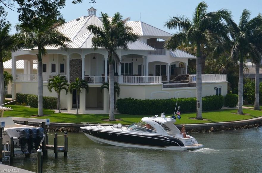 Absolutely exquisite and elegant 2011 Key West Bay Front Estate offers an unparalleled combination of quality, amenities, finish and opulence. This luxurious estate offers amazing water views of Estero Bay and a multitude of features and finishes that are truly magnificent and incomparable. Gourmet kitchen with top of the line appliances, copper twin sinks in kitchen, solid granite countertops, outdoor kitchen with fireplace and 2nd story infinity edge pool/spa,  custom elevator, boat dock and lift, observation pier,  55' RV garage and first level garage can hold up to 6-8 performance cars.  Breathtaking views can be seen through 9 ft' pocket, electric sliders.  Only a ten minute ride to the Gulf of Mexico by boat.  Owner will consider land contract.  Schedule your private showing today.