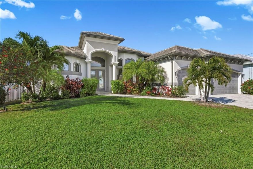 Experience the best of Florida Luxury Waterfront Living with this exceptional Cape Coral Home. This is THE home where you will experience the waterfront living you are looking for. As you enter through the front door, you will immediately be drawn to the magnificent view! The sparkling water and evening sunsets will delight you. This location offers Gulf Access, captivating straight-line water views and is only minutes to the North Spreader Canal.  Enjoy the quiet neighborhood, on a peninsula, with no traffic.  The home offers three bedrooms plus a den with an open concept floor plan that is ideal for entertaining. The outdoor living space will be your own private oasis, and features a heated saltwater pool, a spa and fully functional kitchen. Keep your boat ready on the covered boat lift. Bamboo flooring enhances the spacious primary bedroom which flows into the bathroom featuring a walk-through shower.  A spacious, 3 car garage completes this home.   Whether you’re heading out for a day on the water or enjoying sunsets from your lanai, it’s time to live the Southwest Florida Lifestyle You Deserve!