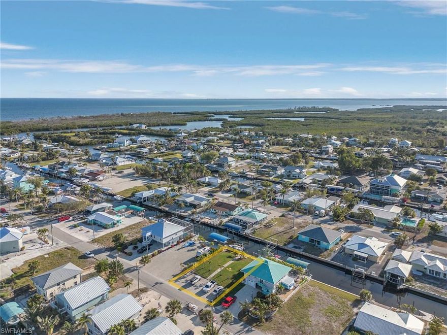 Prime Waterfront Lot – Ready to Build! Seize this rare opportunity to own a ready-to-build lot with direct access to Charlotte Harbor and beyond! This premier homesite is boater’s paradise, featuring 2 boat lifts and new seawall already in place, so you can set sail with ease. Fill has already been added to raise the elevation to 8 feet. No flooding has occurred on this property. Located just minutes from Boca Grande Pass, home to some of the best Tarpon fishing in the world, this property is ideal for those who love life on the water. Nearby marinas, waterfront dining, and island escapes make this the perfect setting for your dream coastal retreat. Don't miss this chance to create your own slice of paradise! OWNER FINANCING IS AVAILABLE