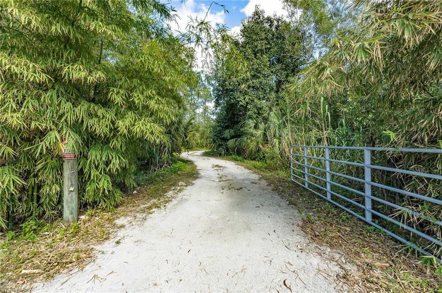 Your Private Oasis Awaits - Discover 14.75 acres of Breathtaking Natural Beauty and unmatched Privacy. This partially Fenced property is comprised of Two Parcels—4.75 acres and 10 acres—offering flexibility and space for your vision. At its heart lies a Serene Lake, the perfect backdrop for peaceful reflections and abundant wildlife sightings. A prepared building pad is ready for your custom dream home, with zoning that accommodates single-family residences, manufactured, and mobile homes. The land is enriched with a greenhouse and a diverse collection of plantings, including banana, fig, oak, pine, bamboo, and multiple palm species. Designed with Sustainability in mind, the property features solar-powered irrigation, established electricity, and a private well equipped with reverse osmosis water treatment, making it ideal for eco-conscious living. With Natural Beauty at every turn and Abundant Wildlife, this picturesque property is a rare gem for those seeking a serene retreat or a unique investment opportunity. Don't miss this chance to own a rare piece of Natural Elegance!