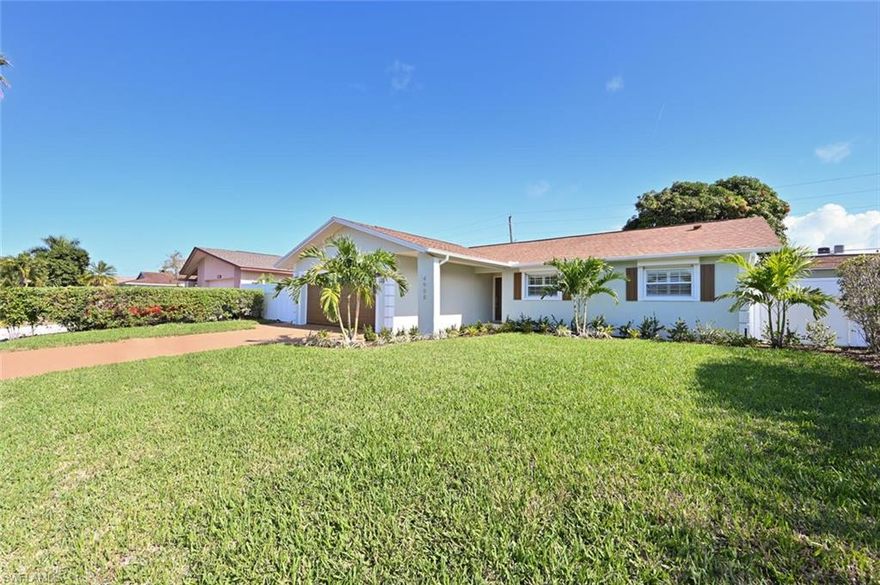 Completely Renovated Open Floor Plan located in highly desirable neighborhood of Westlake, right in the heart of Naples. This FULLY RENOVATED 3 bedroom and 2 full bathroom home has been completely renovated top to bottom with: "wood like" high end luxury vinyl flooring throughout all rooms, brand new Stainless Steel kitchen appliances, Pompeii Quartz counter tops, extra large island for prep space and room for bar stools, Farm sink in kitchen, bathrooms are re done with spectacular high end finishes, all windows have new plantation shutters, epoxy garage floor, hurricane shutters on all windows, extra living space in the backyard that is glassed in so you can enjoy the beautiful SW FL sunrise with a cup of coffee in the morning!  The back yard is fully fenced in and the yard has been freshly landscaped and has new sod in the front. Close to everything in Naples. Just blocks from the beach, across the street from Waterside Shops and minutes to Mercato and The Pavilion for shopping, movies and great restaurants. HVAC 2013, Roof 2010, Windows replaced 2008, No HOA fees. This home is a fully renovated MUST see. This home is located in an "A" rated school zone and not in a flood zone!