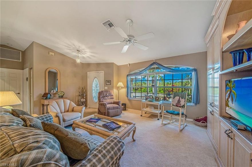 Open airy home with great room floor plan, two master suites with baths and walk-in closets.  Large lanai with covered and open areas with plenty of privacy around the pool. New air conditioner in 2016; new roof in progress.