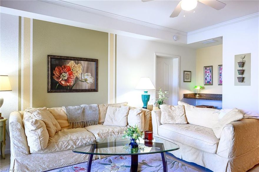 Nestled in central Naples along the desirable Livingston Rd corridor, this ever popular split 2bed/2bath Tuscany floorplan offers pool-side/lake-fountain features to better enjoy Naples' dazzling sunsets from the comfort of your end unit lanai. Sold "As Is", furnished, with unique decorative details, this condo is equipped with full-size washer & dryer, stainless steel appliances, granite countertops and raised panel cabinetry throughout. Each bedroom has a lake view and walk-in closet. Newer HVAC system installed in 8/2024 and carries transferable extended warranty and service maintenance; new water heater installed in 11/2025. Price includes 1 of 5 attached garages - recessed with extended covered car space. Positano Place is a fiscally sound, gated and patrolled, pet friendly community with onsite property management, central elevator per building, and offers resort-style amenities, with proximity to many local points of interest, world-class shopping and dining and approximately 5 miles to beautiful Clam Pass beach.  Quarterly fees include: water/sewer/county trash collection/bundled internet/reserves. Association will be replacing all windows with hurricane impact windows.