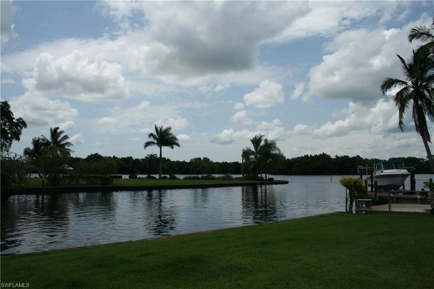 The view and water access you have been looking for at the price you've been waiting for!!!!! Truly a rare find unique home and beautiful oversized lot on the water.  This older but well maintained home is in ready to move in condition and has some of the most beautiful views you will find in Southwest Florida at any price. Watch the sunset while fishing at your own concrete dock, or jump in your boat and at the end of your canal be in the Caloosahatchee River and be fishing at the railroad trestles within just a few minutes. On days your ready for a little longer boat ride you can head down to the mouth of the river, the gulf and the beaches. By land you're only a few minutes away from I-75 and a short drive to the Southwest Regional Airport. At this price the home is perfect for whatever you're looking for:  an awesome winter retreat on the water, great investment, or you can do some renovations and make it the home and property of your dreams. Properties like this don't come along very often, call today to take advantage of this rare opportunity!!!!