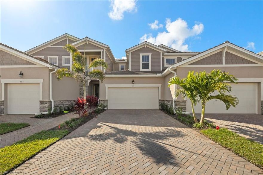 Extensive waterfront view, walking distance to the amenities this is one you don't want to miss -- The Carmel coach home is a 1st floor end unit (1,406 sq ft under air) home that is designed to enhance your lifestyle. Featuring Smart Home Technology, 2 bedrooms, 2 baths, and a 2-car garage, upgraded design package, this open and airy floorplan has a natural flow that lives like a single-family home. A beautiful designer kitchen with 42" Wood Linen painted Shaker style cabinets, white/gray vein quartz countertop, glass subway tile backsplash and large island with breakfast bar. Adjacent to it is a sunlit dining area. The kitchen overlooks the airy Great Room that is highlighted by expansive sliding glass doors that lead to the covered, screened lanai. The owner’s suite is spacious and adjacent to the private owner’s bath with a walk-in closet and a linen closet and a storage closet. The 2nd bedroom features front and side windows and is adjacent to the 2nd full bath. Direct access to the home is provided through the covered porch or through the 2-car garage. Fantastic location within minutes to Downtown Naples, Restaurants, Beaches, Art District, I-75, Shopping and entertainment. Photos, renderings and plans are for illustrative purposes only, and should never be relied upon and may vary from the actual home. The photos are from a furnished model home and not the home offered for sale.