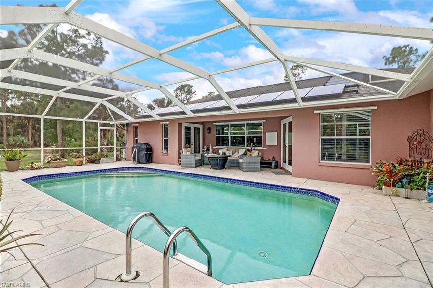 Renovated home located “Close In Estates” (only 6 minutes to nearest Publix & 10 minutes to hospital).  Updated throughout including solar panels that provide close to “net zero” electric usage allowing the homeowner to keep more $ in the bank. Warm and inviting environmentally sustainable Acacia flooring, plantation shutters, saline pool, solar panels, whole house reverse osmosis, fire pit, partial hurricane shutters and gas fireplace.  The master bath has a large shower and a claw foot tub that overlooks the lush landscaping.  Working in the kitchen will be relaxing and enjoyable with upgraded stainless appliances, soft close drawers and a view of the pool and lanai.  There is plenty of storage both in the home and in the garage, which has updated epoxy floor, built in cabinetry and an extra 220 outlet for electric cars.  The work has been done for you, just come enjoy the serene setting with beautiful cypress trees and walking paths through the preserve.