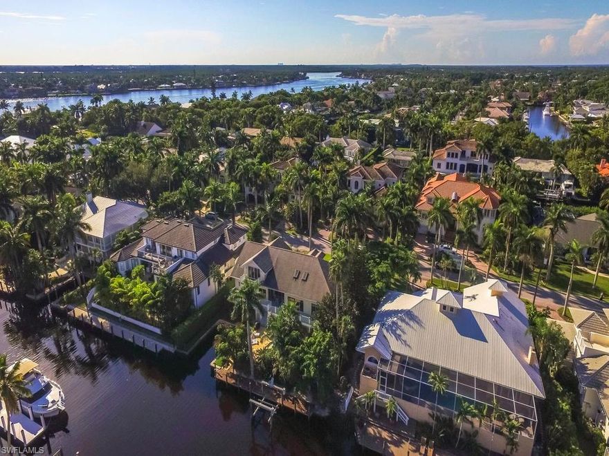 BOATERS PARADISE with GULF ACCESS and 99.5 Feet of waterfront and grandfathered cut in boat slip! One of the best options entry options for a home and or lot for new construction in all of Aqualane Shores! Located just south of Olde Naples, The Naples Yacht Club, and Naples Pier. The exclusive waterfront community is comprised of 500+ homes, of which approximately 350 are waterfront with many homes have private docks, with space for large yachts, and access to deep-water canals. This home is about 10 minutes to the Gulf by boat and just a few minute walk to the beach!