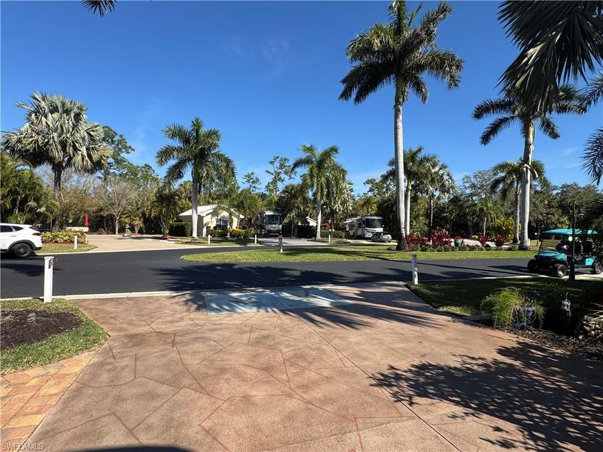 Lot 165 A Private Oasis at RiverBend Motorcoach Resort. Discover the charm of Lot 165, nestled in one of the most peaceful and private locations within RiverBend Motorcoach Resort. This expansive back-in lot welcomes you with lush tropical landscaping and majestic palm trees, creating an atmosphere of serenity and seclusion the moment you arrive. It’s the kind of setting where mornings begin with sunshine filtering through the palms and evenings end with soft breezes and quiet skies. The highlight of this lot is the custom-built outdoor kitchen, a true griller’s paradise and the perfect hub for entertaining. Imagine casual breakfasts outdoors, relaxed afternoon lunches, or sunset cocktails with friends while dinner sizzles on the grill. Plenty of options for seating areas both in the front and back of the lot give you plenty of options to soak up the Florida sunshine during the day or enjoy peaceful evenings under the stars. The coach house is both functional and featuring a kitchenette, a bathroom with shower, and a washer and dryer for added convenience. Whether you're hosting guests or simply enjoying the extra comfort, the space makes entertaining easy. There’s also a generous storage area perfect for bicycles, gardening tools, or anything else that keeps your resort lifestyle running smoothly. One of the most desirable features is the north-facing orientation, helping keep your motorcoach cooler on sunny Florida days. With wide roads and beautifully landscaped surroundings, the setting is ideal for relaxing strolls around the resort or enjoying time outdoors with your four-legged companions. Life at RiverBend Motorcoach Resort offers an exceptional blend of luxury, recreation, and community. Residents enjoy access to a private boat ramp leading to the scenic Caloosahatchee River, making it easy to head out for boating, fishing, or sunset cruises. The resort-style pool, complete with a poolside bar and multiple hot tubs, creates the perfect place to unwind and socialize. For those who enjoy an active lifestyle, RiverBend offers eight pickleball courts, along with bocce, shuffleboard, horseshoes, and a putting green. The community also features a fitness room, billiards room, an R/C racetrack, a charming hobby train garden, and an R/C boating club, just a few of the unique amenities that make RiverBend such a vibrant and engaging place to call home. You're not simply purchasing a property, you're stepping into a welcoming community filled with beautiful surroundings, wonderful neighbors, and a lifestyle designed for relaxation, recreation, and unforgettable moments. Bring your motorcoach and start making memories in this premier resort destination. Your slice of paradise at RiverBend is waiting. Some of the personal property in the images convey with purchase.