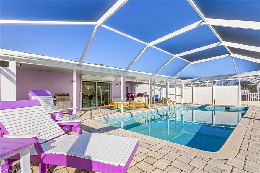 Experience peaceful, laid-back island living with quick direct Gulf access to open water. This bright and spacious 2-bedroom, 2-bath home offers an open living area that flows seamlessly to a large heated pool and screened lanai overlooking the covered boat lift and dock. Southern exposure provides all-day sun on the pool, making outdoor living especially enjoyable. The interior has been freshly painted and extensively updated. Major improvements include a new roof with architectural shingles, new soffits and gutters, a new HVAC system with ductwork, and a whole-house air filtration system (2024). The kitchen features all-new cabinetry with soft-close doors and drawers and new Samsung appliances, along with custom wall bar and illuminated display cabinetry. Additional upgrades include a rebuilt ceiling lighting system with puck lights, a custom entertainment/display wall unit, and a custom closet in the primary bedroom. Outdoor enhancements include a re-screened pool cage with No-See-Um screening and modified picture window screening, a sealed and resurfaced pool with new tile décor, a new pool pump, and a front door with impact glass. Low-maintenance landscaping and improved drainage add to both curb appeal and functionality. For added peace of mind, the property includes a 2025 Flood Prevention System designed to keep exterior water out of the home, along with a septic pipe flap to help prevent interior water intrusion.