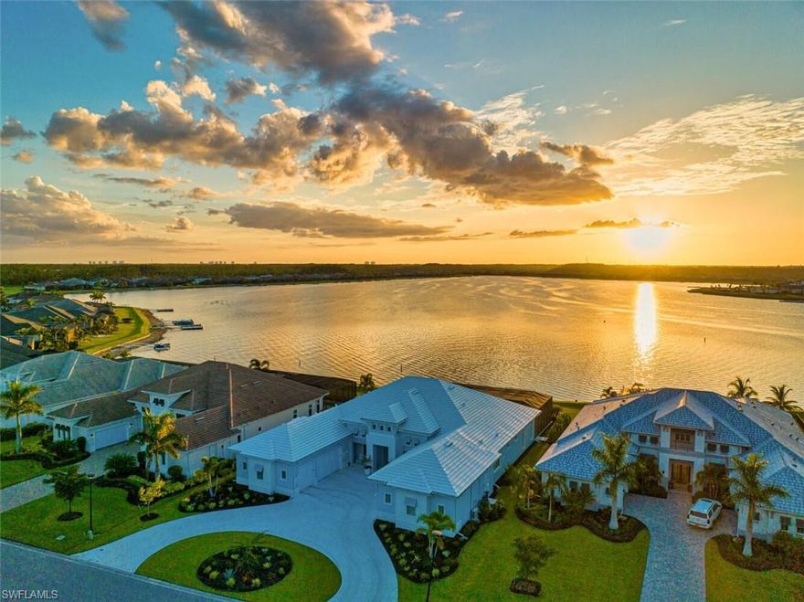 H11700 - Waterfront Grand Estate Home located on the private peninsula in WildBlue. This home has more than $1M in upgrades, and was custom re-designed and engineered to include an air-conditioned six-car garage with 12-foot ceilings, remove interior walls and outdoor columns to capitalize on sunset views. Beautiful custom wide-plank flooring throughout, chef's kitchen with T-design kitchen island and Thermador professional gas appliances. Each room features unique designer tile and lighting selections. Two washer/dryers. Four luxurious bedrooms, plus office and bonus room, 41/2 baths, open-concept living make this a gracious home for entertaining friends and family. Pocketing doors create a seamless transition outdoors to the custom pool and spa, living room, dining area, summer kitchen and fire pit seating overlooking WildBlue's largest lake. With western sunset views, the outdoor living is truly magical! Custom and designer furnishings were carefully curated to complement every element of this stunning home. A boater's paradise, the property includes a deeded dock with electric and water. Boat to the new amenities center, restaurant and spa. Welcome to your Florida Oasis!