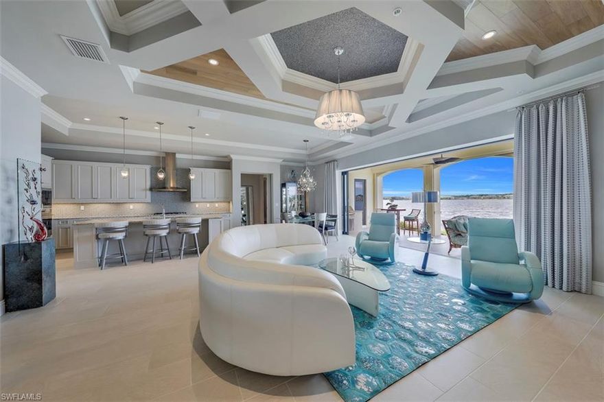 Click virtual tour to walk through this luxury condo with over $100,000 in designer upgrades, natural French oak wide plank wood  inlay in the ceiling, outdoor summer kitchen, designer lighting throughout, 12 x 24 tile, sub zero refrigerator, 6 burner stainless gas cook top, garage with custom built-ins and epoxy sealed floors, and electric hurricane shutters with electric screens. Come enjoy this wide open panoramic home on lake Como. Miromar Lakes features 700 acres of fresh water lakes, with boating, fishing, swimming, water skiing, 3 miles of sand beaches, Caribbean style beach grill, club house, pool, full service spa, fitness center, equity golf, tennis and many other fantastic amenities. Miromar is just 10 minutes from Southwest International Airport and next to Florida Gulf Coast University with large shopping malls within minutes.