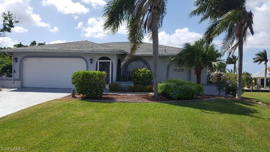 LOCATION! LOCATION! LOCATION! Picture yourself in this pristine waterfront home enjoying the Florida sunshine and vacationing every day.  Close to shopping, dining and any amenities you can imagine.  Attention to detail and pride of ownership are evident inside this home and in the tropically landscaped yard.  New carpeting has been recently installed.  This home is move-in ready and waiting for it's new owner.  Watch for the manatee that frequent the Matlacha Isles Canals and fish for many varieties of fish right from your seawall. Enjoy your morning coffee sitting by the water on the terraced and beautifully xeriscaped back yard. The waters around this area offer some of the finest fishing in Florida. It is a short boat ride to  to the Gulf of Mexico, via  Boca Grande Pass, the Tarpon Capitol of the world