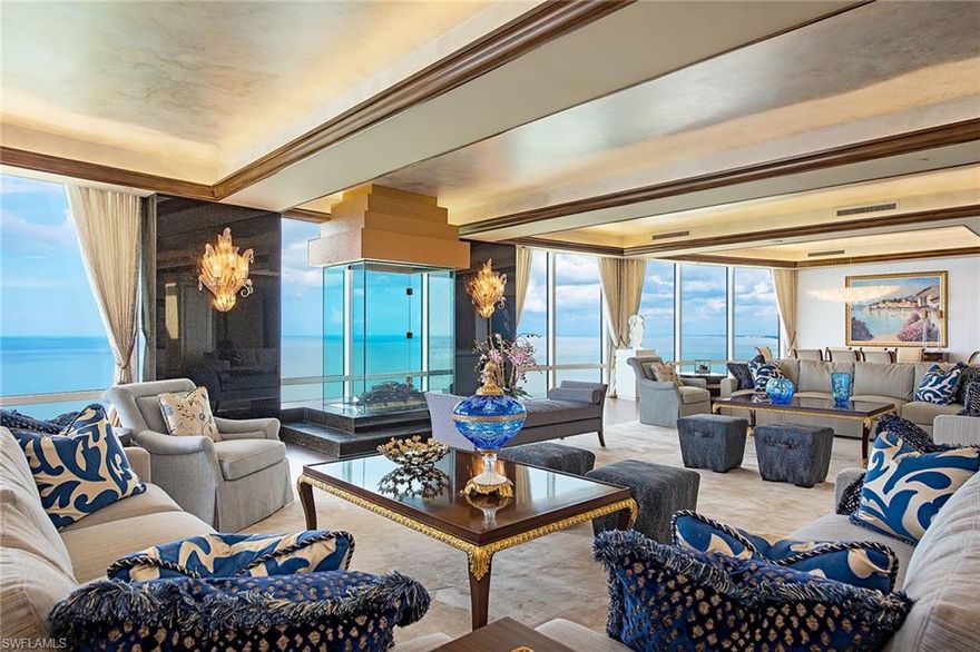 Rarely available "top of the tier" penthouse in one of Naples' most sought-after buildings! Majestically perched, this home in the sky offers unsurpassed three hundred and sixty degree views of the glistening Gulf waters, Venetian Bay and the sparkling night lights of the City of Naples! Nearly 8,000 square feet of exceptional living includes a formal grand salon and dining room, library/den, gourmet kitchen with gas cooking, large family room, 5 bedrooms, 5 full and 1 half baths. Distinctive architectural touches include a skylight upon entry, 2 fireplaces, 10 foot ceilings, 8 foot doors, custom millwork, 3 terraces and more. Le Rivage offers the complete luxury lifestyle with unmatched amenities, including 24-hour front desk attendant, saline pool and spa, social room, top-notch fitness room, massage room, two Gulf-view guest suites, four parking spaces, as well as an air-conditioned storage locker and beach storage. The Village on Venetian Bay is a stroll away and has been heralded for its waterfront setting, wonderful dining and eclectic mix of specialty retailers. Park Shore residents may purchase or lease a boat dock located on Venetian Bay.