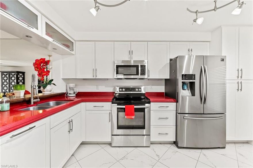 Exquisitely Renovated Lakeside Condo has ALL the Upgrades!  Kitchen features custom solid wood cabinets with pull outs and soft close drawers, counter-depth refrigerator, Miele dishwasher with cabinet panel front, LG range with blue oven, Silestone countertops, expanded kitchen pass-through with exotic wood eating bar.  Gorgeous tile floors and custom 11" baseboards throughout home.  Custom lighting includes 3 Murano glass fixtures.  1 year-old HVAC features Halo Blue Light purification system.  Tankless water heater creates an extra linen closet.  Freshly painted, light and bright, end unit.  End unit has view of beautiful clubhouse across the lake.  Beautifully furnished and sold turnkey.  Desirable North Naples community of Huntington Lakes is six miles from the Gulf, nestled away and yet close to all the conveniences of shopping, dining, and entertainment.  20 minutes to downtown and RSW.  And as a bonus, this location has the lowest condo fees in Huntington Lakes.