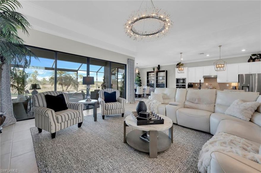 Imagine opening your sliders each day to tranquil PRESERVE VIEWS, a sparkling POOL & SPA, & a spacious LANAI DESIGNED FOR ENTERTAINING. This Lennar SUNSET MODEL, estate series home, in The Place at Corkscrew delivers the ultimate Florida lifestyle w/3 BEDROOMS PLUS A DEN, 3 FULL BATHROOMS, & 2650 SQ FT of single story living that feels spacious & refined. From the moment you arrive, DOUBLE GLASS ENTRY DOORS & a wide foyer w/a 12-FOOT CEILING create a grand first impression. The OPEN-CONCEPT DESIGN places the main living area the center of the home, allowing the kitchen, dining, & living spaces to flow together & open seamlessly to the lanai w/a HIDDEN SCREEN for effortless indoor-outdoor living. The living room is enhanced by an 11-FOOT TRAY CEILING, CROWN MOLDING, a “WOW-FACTOR” CHANDELIER, & a FIREPLACE FEATURE WALL that adds warmth & character. The kitchen is ideal for gathering w/a 12.5-FOOT ISLAND, GRANITE COUNTERTOPS, GE STAINLESS APPLIANCES, BUILT-IN MICROWAVE & OVEN W/AIR FRYER, & a REFRIGERATOR w/a BUILT-IN KEURIG ATTACHMENT, making everyday living & entertaining easy. Outside, the EXPANDED LANAI offers an EXTRA LARGE COVERED AREA w/an OUTDOOR TV, a POOL & SPA w/a waterfall spill over feature, & a PANORAMIC SCREEN ENCLOSURE for unobstructed views of the GORGEOUS PROTECTED PRESERVE! The private primary suite occupies its own wing of the home & features 11-FOOT TRAY CEILINGS W/CROWN MOLDING, PRIVATE LANAI ACCESS, DUAL WALK-IN CLOSETS, & a spa-inspired bathroom w/a HUGE WALK-IN SHOWER, DUAL VANITIES, & GRANITE COUNTERS. A DEN OFF THE MAIN LIVING AREA works beautifully as a home office or flex space, while the SPLIT BEDROOM LAYOUT places the two guest bedrooms on the opposite wing of the home, including one w/an EN SUITE BATH that also functions as a POOL BATH W/LANAI ACCESS & a WALK-IN SHOWER. The second guest room has a convenient full bath adjacent to it so no one has to share a bathroom! The LAUNDRY ROOM includes FRONT-LOADING MACHINES, CABINETRY, A LAUNDRY SINK, & an EXTRA STORAGE CLOSET. The THREE-CAR GARAGE offers EPOXY FLOORS, SPACE FOR A GOLF CART, & an OVERSIZED DRIVEWAY fitting up to 9 cars plus 3 more in the garage!. Additional features include 8-FOOT DOORS THROUGHOUT, ELEGANT CHANDELIERS ON DIMMERS, WHOLE-HOUSE & POOL SURGE PROTECTION, & NEW LANDSCAPING, all set within The Place at Corkscrew. Enjoy the RESORT-STYLE AMENITIES which include a lagoon-style pool w/waterfalls, 100-foot waterslide, splash pad, state-of-the-art fitness center, café, restaurant, & bar. Sports lovers enjoy tennis, pickleball, bocce, basketball, & sand volleyball. A playground & dog park add even more outdoor enjoyment. Nearby Old Corkscrew Golf Club is being redesigned into a premier private golf experience. Just 5mins to Publix, 10mins to Miromar Outlets & Gulf Coast Town Center, 15mins RSW Airport, & 45mins to SWFL beautiful beaches! It's the perfect blend of luxury & convenience. Experience the best of SWFL living at The Place at Corkscrew.