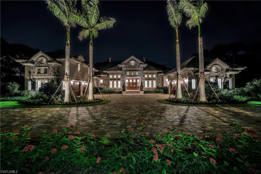 This architectural masterpiece reflects a French Transitional exterior design with stone accents and tumbled-paver circular driveway. The interior design compliments the architecture with large rooms, soaring coffered ceilings, wide-plank French Oak flooring and many windows for natural light. The open concept floor-plan encompasses 6,096 sf under air with formal living areas that blend comfortably with the home’s more casual outdoor living spaces. The design focuses on quality craftsmanship with an array of natural stone and wood elements throughout, plus energy efficient materials and smart home technology to please the discerning buyer. Southern exposure 1.28 acre home site with gated entry and 4+ garage spaces. The split bedroom floorplan includes 4 bedrooms 6 ½ baths, living room & dining area, study/library, den and large 2nd story en-suite bonus room. The gourmet kitchen features Thermador appliances, gas range, custom cabinetry, center island. Luxurious master suite with sunny sitting room overlooking the pool. Outdoor living with summer kitchen, bar, motorized screens tropical resort-style pool & spa with fire features, shell stone deck, dramatic fire bowls, and Pergola.