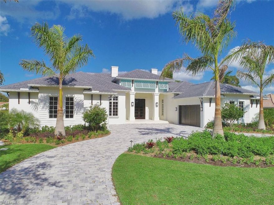 H. 14072 Introducing a stunning new home in the heart of the Moorings on elegant Anchor Rode Drive. Built by Dillman Construction, one of Naples premier luxury builders & designed by RG Designs, this inviting coastal home takes maximum advantage of natural light from every exposure.  Created to reflect today’s indoor/outdoor lifestyle, the home offers the perfect balance of a great room floor plan, PLUS the privacy of a separate living area & den. Incredibly bright and open back garden with 44-foot lap pool & spa, water fountains, bubbling pool and sunshelf. Expansive outdoor living area with kitchen, linear gas fireplace, pool bath, outdoor shower & electric screens & shutters.  Luxury finishes throughout the inside as well, including wide plank Legno Bastone European oak floors, Sorhegui tiles, custom wood trim and wainscoting, and exquisite wall finishes. Other great features include Sub Zero & Wolf appliances, hidden walk in pantry, wet bar and Sub Zero wine cooler. Rounding out the floor plan are 4 bedrooms, each with en-suite bath, and garage space for 4 cars. Perfectly located just minutes to both the private Moorings Beach Park & the shops & restaurants of Venetian Village.