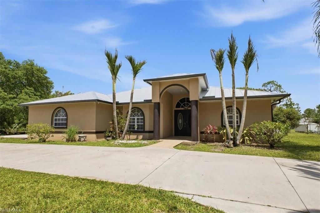Photo of 1420 Columbus AVE, LEHIGH ACRES, FL 33972 (MLS # 226017508)