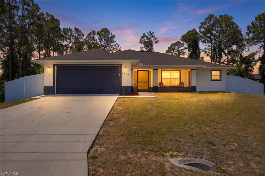 Photo of 2907 18th ST SW, LEHIGH ACRES, FL 33976 (MLS # 226017776)