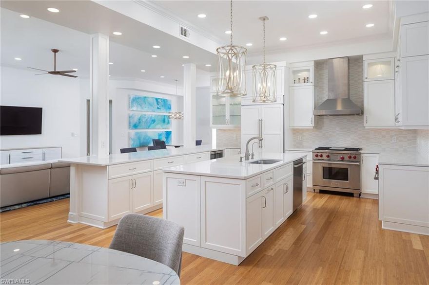 This newly renovated Cannes villa boasts 11-foot high elevation and came through the hurricane beautifully. Inside, a rare 3,300+ square feet exudes refined modernity, unrestrained beauty and superior craftsmanship. Voluminous rooms with 11-foot ceilings, this end-unit has walls of glass spilling natural light throughout. Designed for entertaining, the floor plan is open and flowing, centered upon an impeccable gourmet kitchen, complete with natural gas range and two ovens. Boasting three sumptuous bedrooms plus large private den, three full baths, casual and formal dining spaces and multiple TV lounging rooms. No detail was overlooked in the 2021 builder renovation: custom cabinetry, wood floors, lighting, fireplace, impact sliders, 2-zone HVAC, and new luxury finishes. Owners enjoy all the benefits of a private home with a 2-car garage and all the freedoms and carefree lifestyle of condominium living. Insurance and maintenance of the building and common areas are provided. Resort pool is just steps from the front door. Offering a new age of redesign for Cannes, a pristine gated Crown Colony enclave of only 16 villas, this reborn villa awaits its illustrious owner.