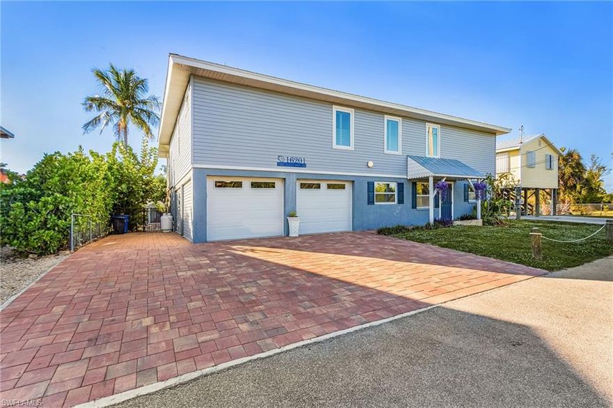 Nestled on one of Pine Island’s premier waterfront streets, this spacious coastal home delivers the ultimate blend of comfort, style, and island living. Offering TWO FULL LEVELS OF LIVING SPACE. The upstairs has been completely renovated and is absolutely gorgeous!! With 5 bedrooms and 4.5 baths, the home provides an inviting layout with plenty of room to spread out.  A highlight for avid boaters, the property features a COVERED 10,000# BOAT LIFT, offering quick direct access to Pine Island’s scenic waterways where you will find world-class fishing and exploring nearby barrier islands. Your waterfront adventure begins right in your own backyard. Recent updates include NEW HURRICANE RATED DOORS AND WINDOWS- 2025. The Seawall was reinforced in 2021. Metal Roof 2019, New wooden dock 2022. Upstairs renovations in 2021 include new electrical wiring, plumbing and HVAC. There is plenty of storage and a spacious TWO CAR GARAGE for all your toys.  Pine Island's charm is found not just in the home, but in the lifestyle. Enjoy lower-density traffic, peaceful surroundings, and a laid-back coastal vibe. Feel like you are on vacation every day!!