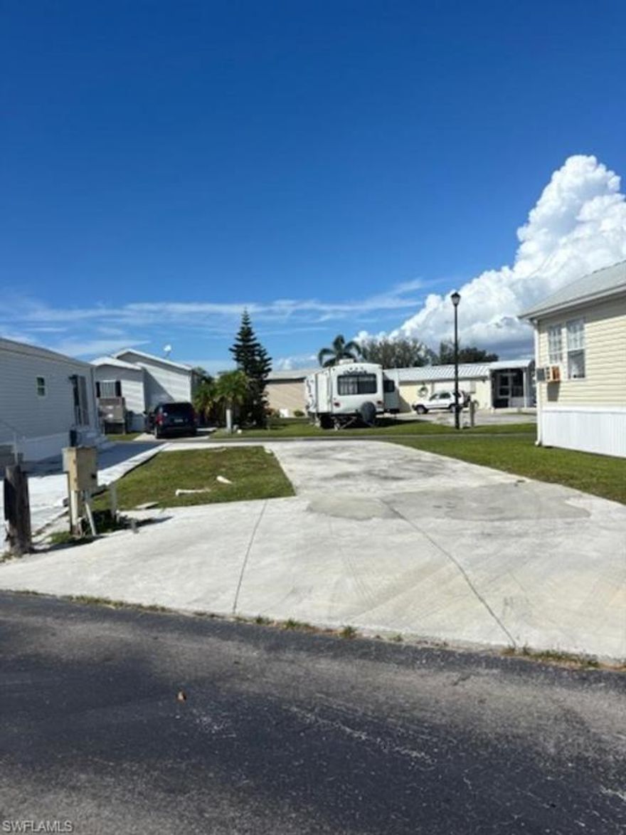 Bring your RV, Tiny home or Travel trailer to Holiday Condo.  Build a new manufactured home on your property.   Own your piece of Paradise and vacation here during those cold winter months.  Holiday Condo is NOT 55+.  It is pet friendly and you are close to shopping, the beaches and low monthly fee of $167.00.  This vacant lot is available immediately.  Easy to access the lot from the front or back for easy pull through.  The low monthly fee cover your water and sewer, trash pick up and lawn maintenance.  The community has two heated pools, one indoors, a hot tub and a sauna.  Pickleball, tennis courts, shuffleboard, horseshoes, bocce,  all the social activities to keep you young.  Or just sit in the sun enjoying the warm winter.  2 pet limit and motorcycles are permitted.