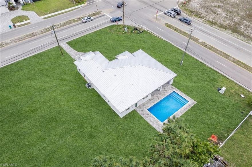 Brand-new construction scheduled for completion by the end of May or sooner, offering modern design, quality finishes, and an unbeatable location in the rapidly growing Northwest Cape Coral corridor. This spacious 4-bedroom, 3-bath home features a highly desirable layout with two primary suites, each with its own private bathroom, ideal for multi-generational living, guests, or added rental flexibility. A third full bathroom, conveniently serving as a guest bath, offers direct access to the pool area and is perfectly designed for future outdoor living.

The home is built with durability and peace of mind in mind, including a metal roof, impact-resistant windows, and no flood insurance requirement. The property will be fully fenced and offers dual access from both Nelson Rd N and Embers Pkwy, providing convenience, flexibility, and ample parking for boats and recreational vehicles.

Located just minutes from Pine Island Road, one of Cape Coral’s main commercial corridors, you are surrounded by shopping, dining, gyms, and everyday conveniences, including major retailers, grocery stores, and Sam’s Club. Nearby schools include Mariner High School and Mariner Middle School, making this an excellent option for families. This area is experiencing strong growth, with ongoing and planned developments along the Pine Island corridor, bringing new retail, dining, and lifestyle amenities. With continued expansion in Northwest Cape Coral, this property is well-positioned for both comfortable living and long-term value.

Whether you’re looking for a primary residence, second home, or investment opportunity, this property offers modern construction, strong potential, and a location that continues to grow. Be the envy of the neighborhood in one of Cape Coral’s most desirable up-and-coming areas.
More pics to come.