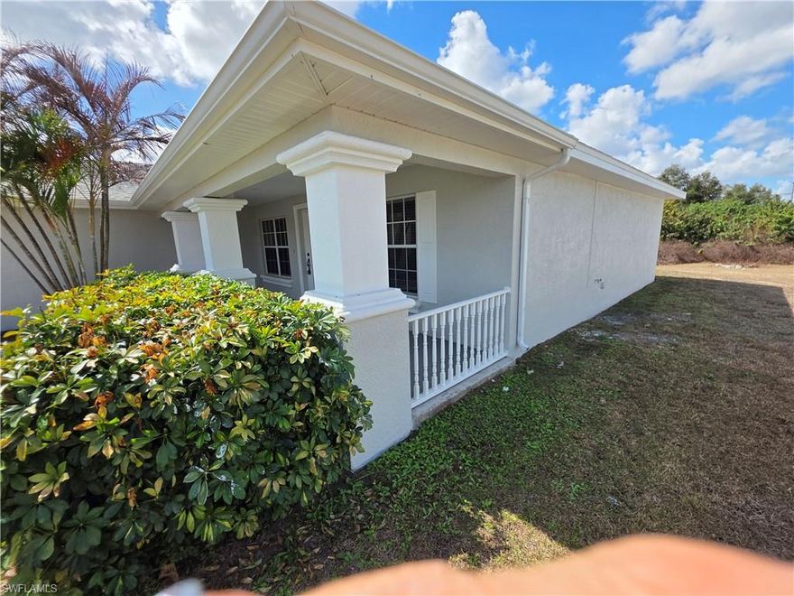 Residential Single Family home in Lehigh Acres, 3-bedroom, 2-bath home a  two-car garage 1,408 square feet of living space under air, for a total of 2,222 square feet total. Tile floors throughout, screened lanai.