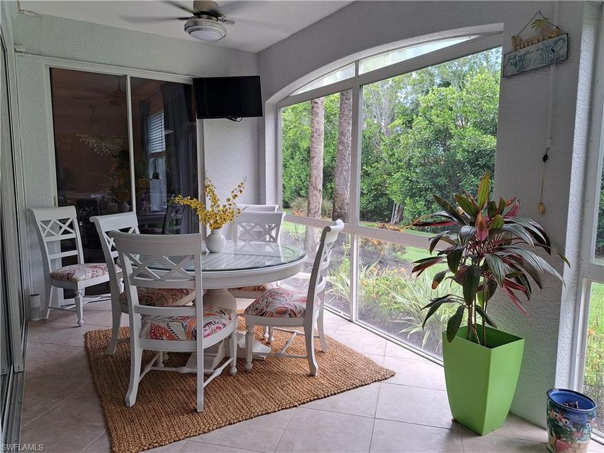 Now Available for Rent! Open the windows and let the tropical breeze flow through this spacious and sunny first floor Mariposa condo. 1,760 sq ft with 2 bedrooms plus den, 2 baths, and a large wrap-around enclosed lanai with removable windows looking out to the garden and landscaped setting - perfect for entertaining! Open floorplan with beautiful wood flooring in the bedrooms and tile throughout the rest of the condo. Attached 2 car garage with EV charger.  Within walking distance to the neighborhood pool.