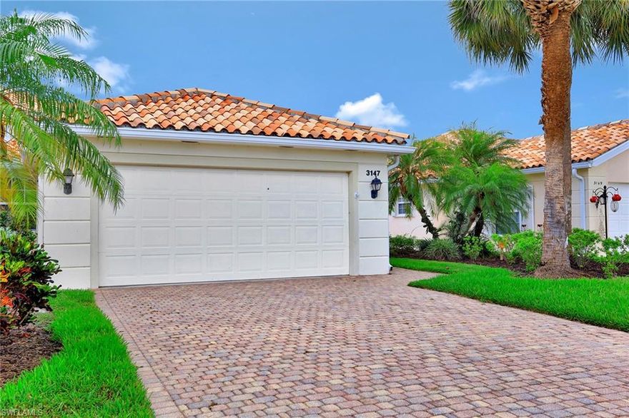 Come and see this charming, attached villa, available for immediate occupancy in one of the most affordable and amenity filled communities in Naples - Village Walk. This home offers two large bedrooms that are almost identical in size and two bathrooms. The spacious and open split floor plan features living room with a built-in wall unit, dining area and a large kitchen with stainless steel appliances. The DiVosta built solid, poured concrete construction is in a very quiet and private location, overlooking a lake. This lovely home is located in the desirable Village Walk community where the fees include the use of all amenities, lawn maintenance, cable and 24 hour gated entrance. The residents have access to a clubhouse with a full-time activities director, three heated community pools, six Har-Tru Tennis Courts, state of the art fitness center, restaurant and miles of biking and walking paths.