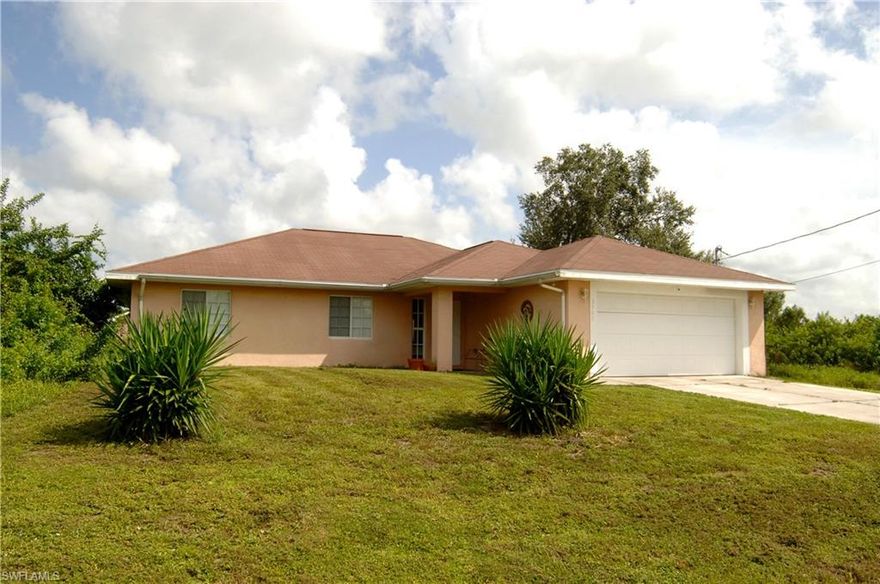MAKE THIS YOUR NEW HOME IN SW FLORIDA. LOCATED ON A DEAD END STREET, THIS HOME OFFERS A LOT OF PRIVACY FOR YOU AND YOUR FAMILY. AS YOU ENTER THE FRONT DOOR, THERE IS A LARGE FOYER AND ALL BEDROOMS AND BATHROOMS ARE ON ONE SIDE OF THE HOUSE CREATING A LARGE LIVING ROOM AND ENTERTAINMENT SPACE WITH VOLUME CEILINGS. THE OPEN KITCHEN SPACE ALLOWS FOR SIGHT LINES TO THE LIVING ROOM AND DINING ROOM AREA. A 100 SQ.FT. PATIO CAN BE USED AS-IS FOR OUTDOOR DINING OR IMPROVED TO SUIT YOUR FAMILY NEEDS. THIS HOME COMES WITH A 1 YEAR HOME WARRANTY FOR COMPLETE BUYER COMFORT. DETAILS UPON REQUEST.