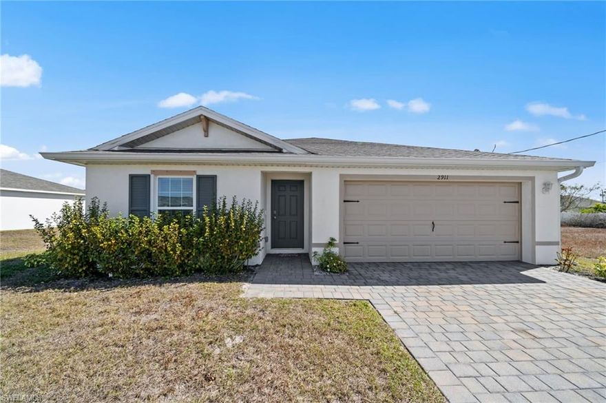 Welcome to your brand new 1,389 sq. ft. home in a prime NW Cape Coral location near Nelson Rd and Kismet Pkwy! This beautifully designed Boardwalk floor plan features 36” designer white kitchen cabinets with hardware, quartz kitchen counters with an undermount sink, and solid surface bathroom counters. Enjoy 6” x 24” plank tile throughout the main living areas, carpeted bedrooms, and ceramic tile in both bathroom showers. The home comes complete with stainless steel kitchen appliances, a white washer and dryer, blinds on all windows (except the slider), a paver driveway and lanai, a covered lanai, full irrigation system, electric garage door with opener, and a convenient home-is-connected package. This home combines modern style, functionality, and comfort, making it the perfect place to call home in Cape Coral.