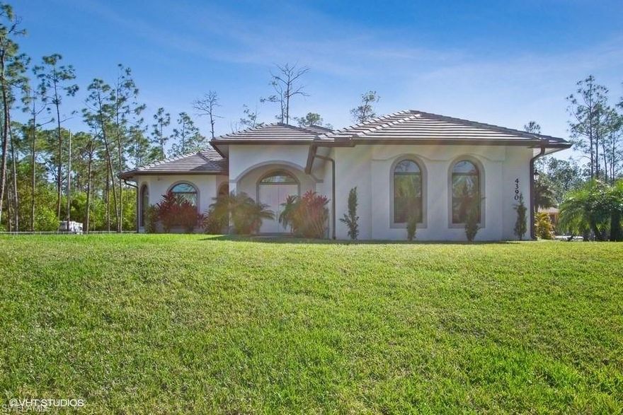 2015 Custom Built Golden Gate Estates home. This is not your typical property. Every inch of this home has been custom designed. Porcelain tile throughout, Kitchen has a modern custom waterfall granite island with wood cabinets & stainless steel appliances. Both bathrooms have been totally upgraded with tons of extras. The Huge 2.5 Garage has room for 2 cars plus lots of storage. Brand NEW Tile roof tiles and outside paint. Whole house Reverse Osmosis water filtration. Massive rear lanai with complete outside kitchen. Cameras throughout the home. Front metal gate and chain link for most of the lot. This property has too many extras to list here. You must come in person to really appreciate all it has to offer the new Owner. Bring your pickiest clients, as it wont last.