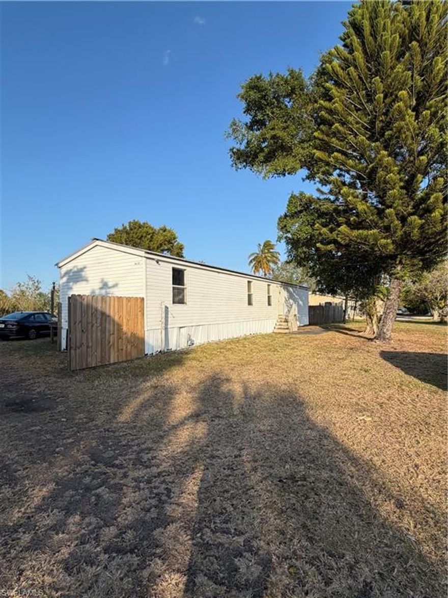 This is a great opportunity to own your own property just outside city limits. This 3/1 single-wide, converted to a 2/1, sits on nearly an acre of land with a body of water in the backyard with potential for a boat dock—a rare find at this price point.

Located in the county, you’ll enjoy lower taxes and utility costs compared to city living. The property offers ample parking in both the front and rear, fencing already in place, and plenty of room to make it your own.

The home needs a little TLC, but for the right buyer, it’s full of potential. Features include a metal roof, updated electrical panel, septic system, city water available, and furnishings included, along with refrigerator and stove.

Conveniently located minutes from Shamrock and Primo Gas stations, close to the City of Clewiston, and approximately 1 hour from Miami and West Palm Beach.

Schedule your private tour today—this one is worth a look!