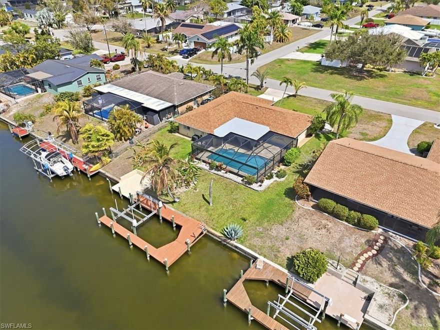 Because this well maintained three bedroom, two bath waterfront home is fully furnished and being offered turnkey you can immediately begin to enjoy your new life of floating in your pool, heading out boating and fishing on the Gulf and improving your pickleball and golf games. This home's convenient location in the heart of south Cape Coral gives wonderfull access to all of the Cape's amazing restaurants and entertainment venues and good access to the barrier islands of Sanibel, Ft Myers Beach and Captiva and downtown Ft Myers' vibrant dining/entertainment district.. As far as checking the boxes that you want in your SW Florida home this one nails it with since it requires no flood insurance, has a 2023 roof, split bedrooms, a large covered and screened lanai, a convenient pool bath, a pass through window from the kitchen to the covered lanai, an inside laundry room with a laundry tub, a walk around dock and a screened front entry that brings the breezes floating through! Finally this property has been a successful seasonal rental if that's what you want to start with.